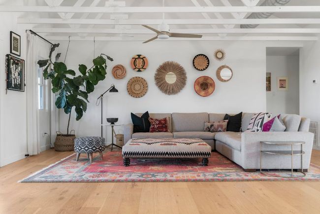 Living room with a ceiling fan, beamed ceiling, and hardwood flooring | Image 15
