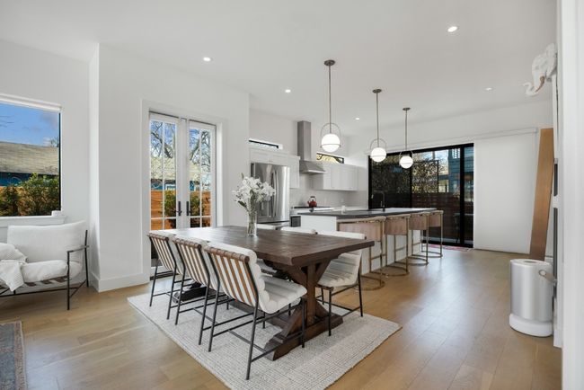 Seamless access to the front and back patios through elegant French doors. | Image 7