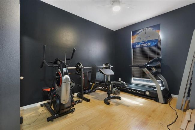 This versatile fourth room, currently a home gym with a closet, can easily become an office or guest bedroom. | Image 25