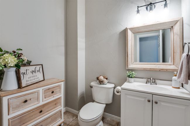 Bathroom featuring vanity, this half bath is downstairs for guests to use and close to office! | Image 26