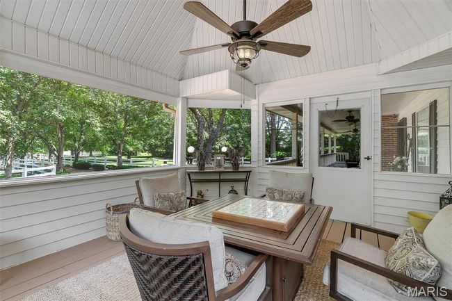Sunroom / solarium featuring a ceiling fan | Image 44