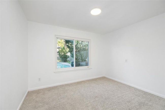 5th room downstairs can be used as an office, workout room, or guest bedroom. | Image 22