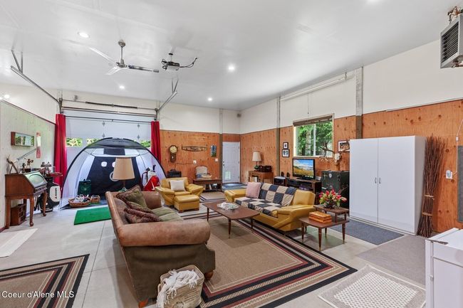 Back Area with 108 inch projector screen and surround sound with curtains open | Image 15