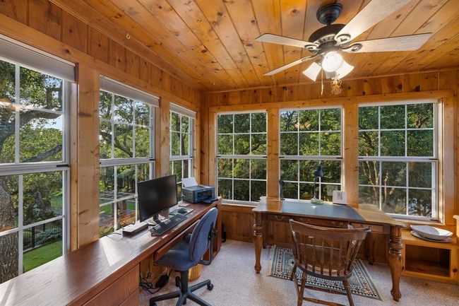 With an enchanting view overlooking both "The Garden of the Blue Horse" and the tranquil river, this office provides an inspiring backdrop for focused tasks and creative endeavors. | Image 21