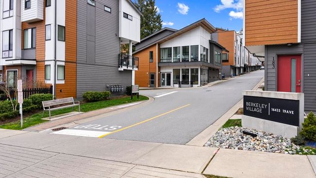 View of asphalt street with a residential view, sidewalks, and curbs | Image 15