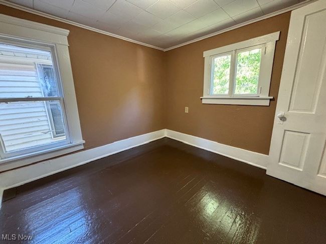 Unfurnished room with wood-type flooring and ornamental molding | Image 14