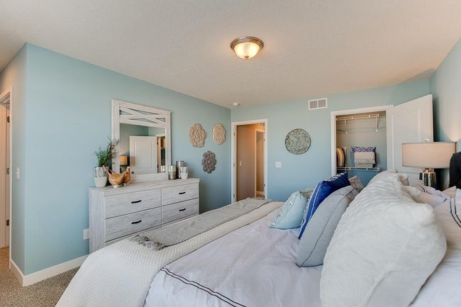 The primary bedroom has the benefit of 2 separate closets! Model home photo, colors and selections may vary. | Image 10