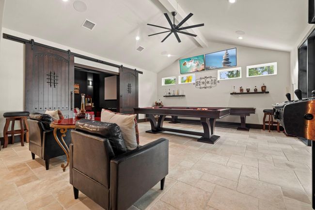 View into the custom wood double sliding doors that lead into theater room. | Image 21