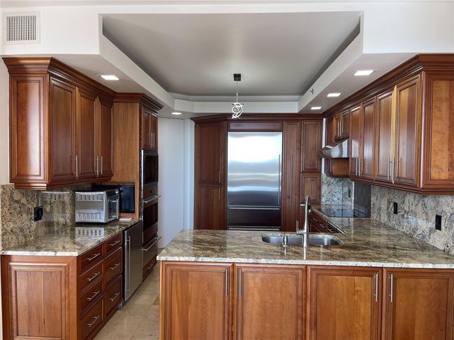 Walnut cabinetry with soft close drawers and doors | Image 19
