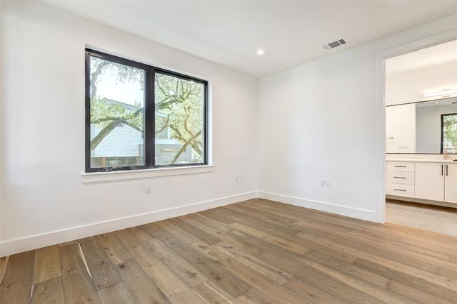 Unfurnished room with baseboards, light wood-type flooring, and recessed lighting | Image 30