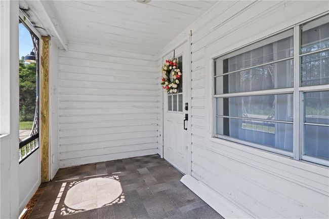 View of unfurnished sunroom | Image 4