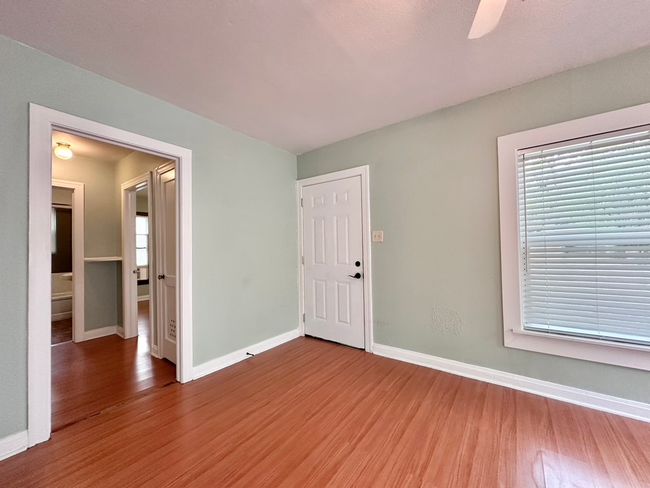 Entrance room featuring wood finished floors and ceiling fan | Image 7