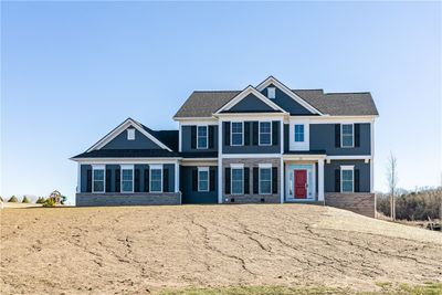 Photo is of a previously completed home of same floor plan. Selections will differ. | Image 1