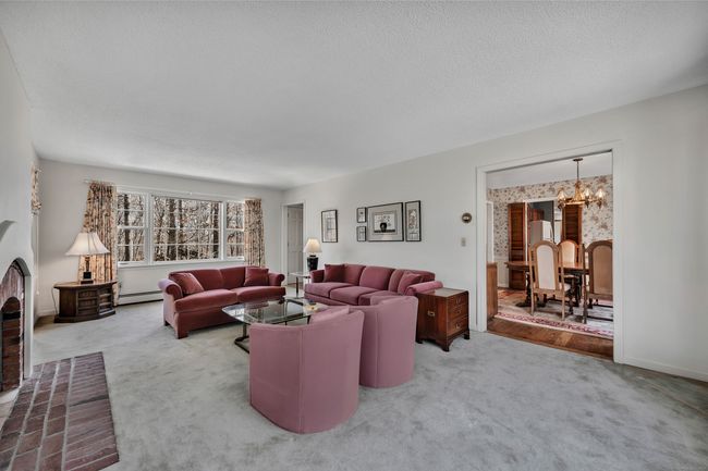 Sunlit living room right off the dining room | Image 13