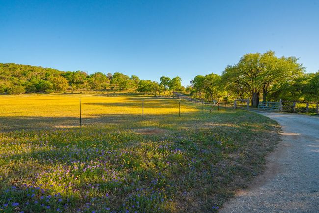 View of property's community with a rural view and fence | Image 38