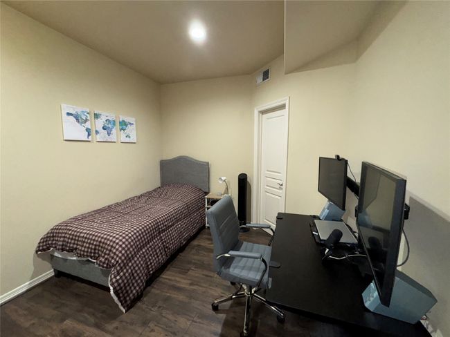 Bedroom with dark hardwood / wood-style flooring | Image 30