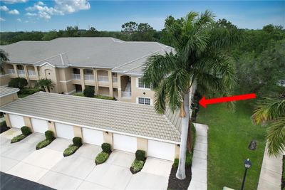 Front of home, note strong stucco and tile roof | Image 1