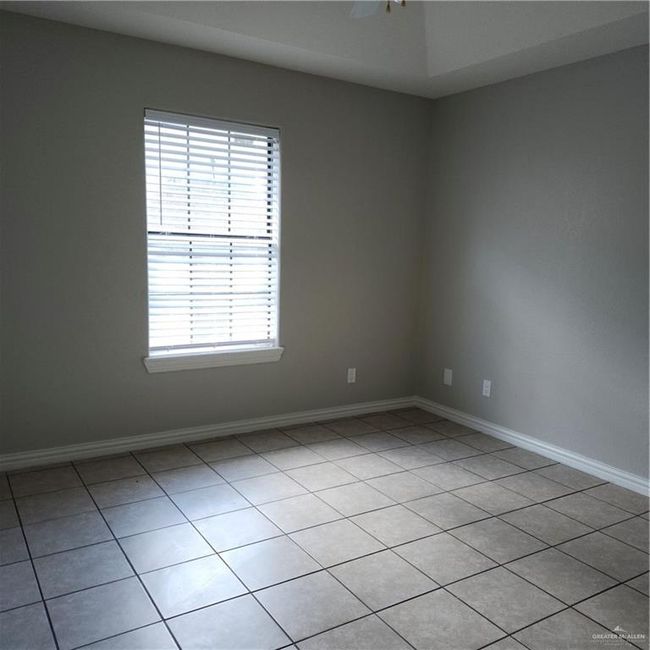Unfurnished room featuring healthy amount of natural light and light tile patterned flooring | Image 5