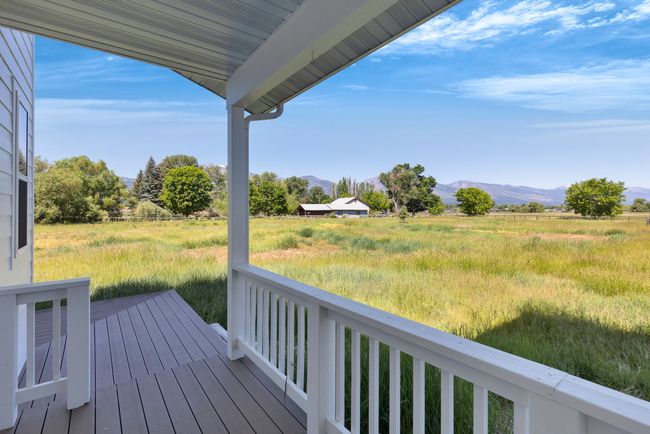 Deck featuring a mountain view and a rural view | Image 51