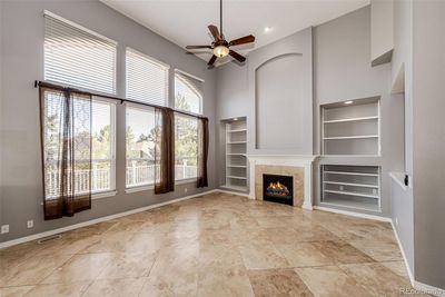 Family room with high ceilings and a cozy fireplace | Image 3