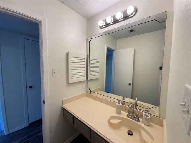Bathroom featuring vanity, wood finished floors, and a textured ceiling | Image 18