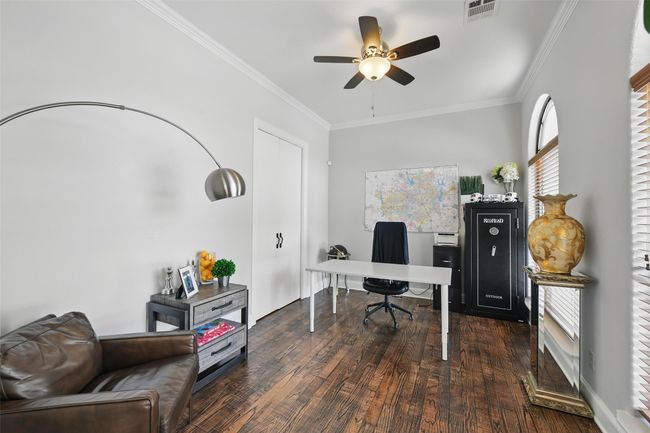 Spacious home office features a closet, wood floors, ceiling fan and lots of light! | Image 6