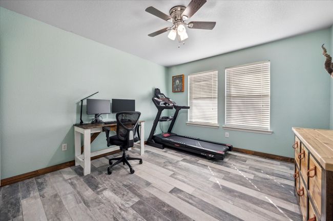 Spacious secondary bedroom with a large closet and no carpet, offering easy maintenance and plenty of storage. | Image 13