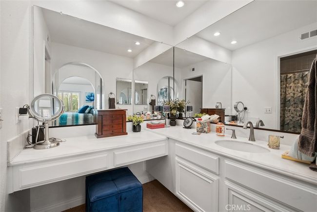 The primary bathroom has a large vanity space | Image 27