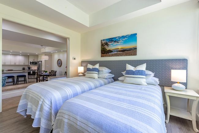 The sliding wood 'barn' doors in the second bedroom open to the living/dining/kitchen area & the | Image 21