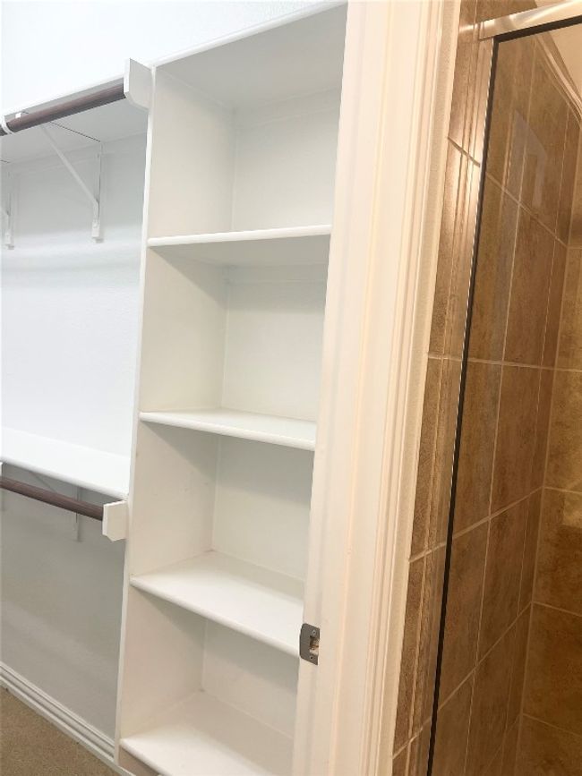 View of walk in closet | Image 14