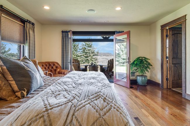 Bedroom with wood finished floors, recessed lighting, and multiple windows | Image 30