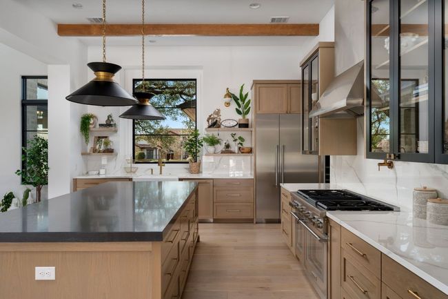 Kitchen featuring visible vents, high quality appliances, beamed ceiling, and open shelves | Image 10