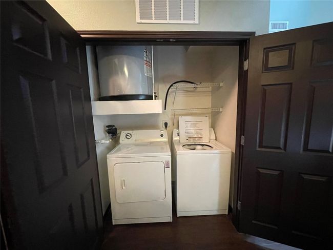 Laundry area with washing machine and clothes dryer | Image 11