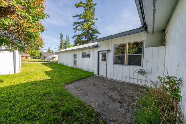 View of green lawn with a patio | Image 28
