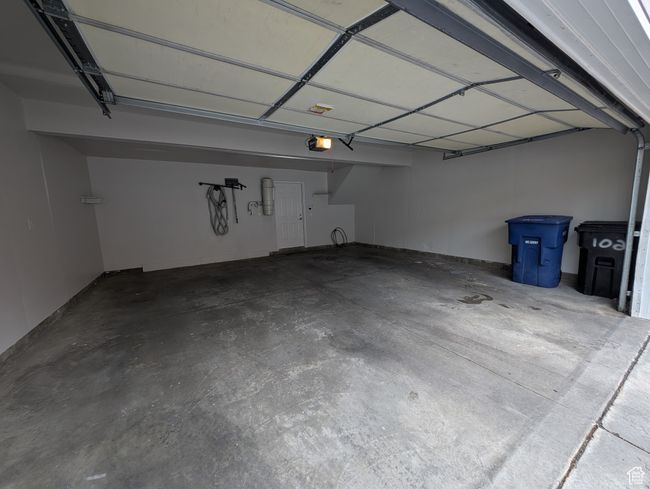 Garage with a garage door opener | Image 29