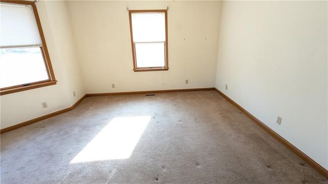 Spare room featuring light colored carpet | Image 28