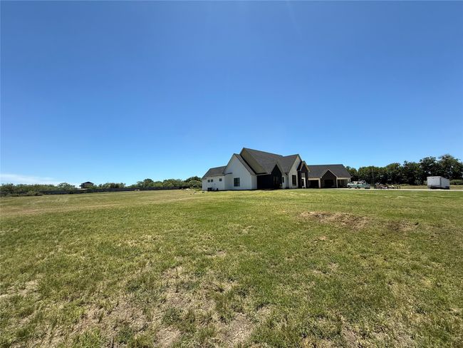 View of green lawn with a view of rural / pastoral area | Image 4