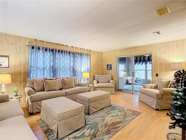 Spacious living area view to the Florida room | Image 5