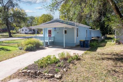 View of home's exterior with a carport double drive | Image 3