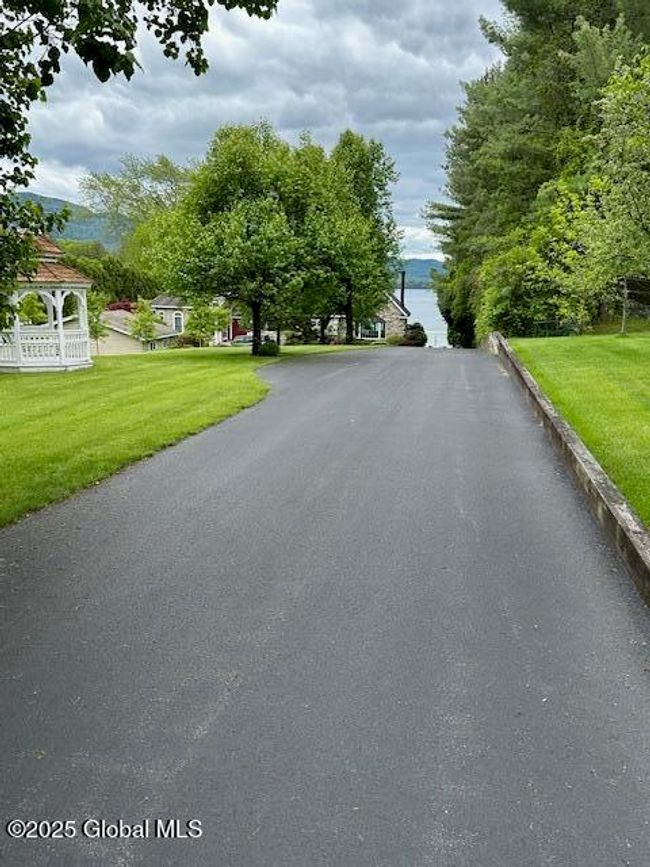 Long Paved drive offers privacy from the road | Image 7
