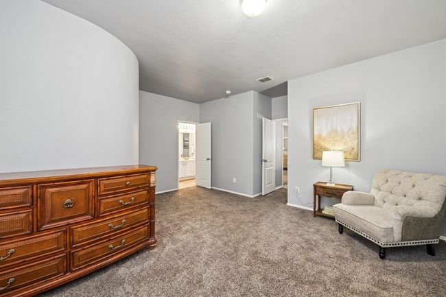 Sitting room featuring carpet flooring, baseboards, and visible vents | Image 40