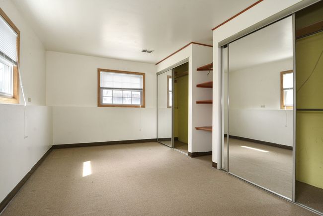 Bedroom 5 with 3 windows and 2 closets | Image 25