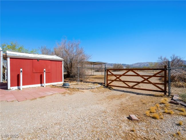 View of gate with an tack room, fence, and a mountain view | Image 52