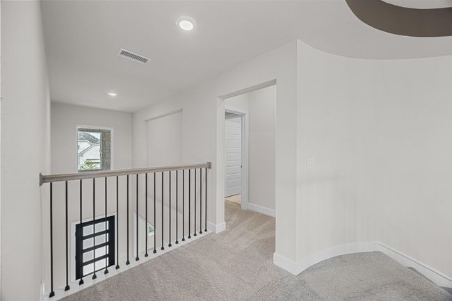 Hall with carpet, baseboards, and recessed lighting | Image 21