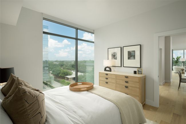 Bedroom with light wood-style floors and floor to ceiling windows | Image 22