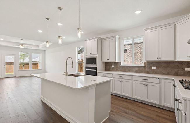 Spacious eat-in kitchen designed with a large island for dining *Real home pictured | Image 4