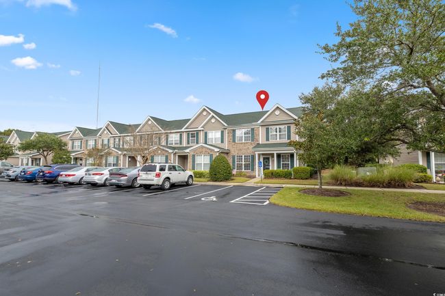 View of property with uncovered parking and a residential view | Image 34