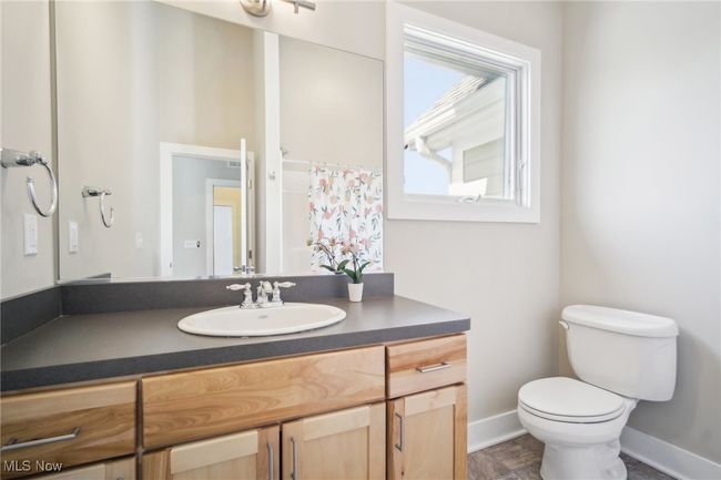 Full bath featuring toilet, vanity, and baseboards | Image 26