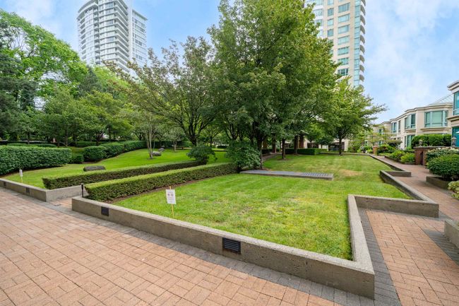 View of community featuring a lawn | Image 26