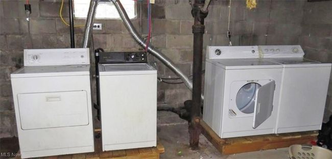 Laundry room featuring independent washer and dryer | Image 6